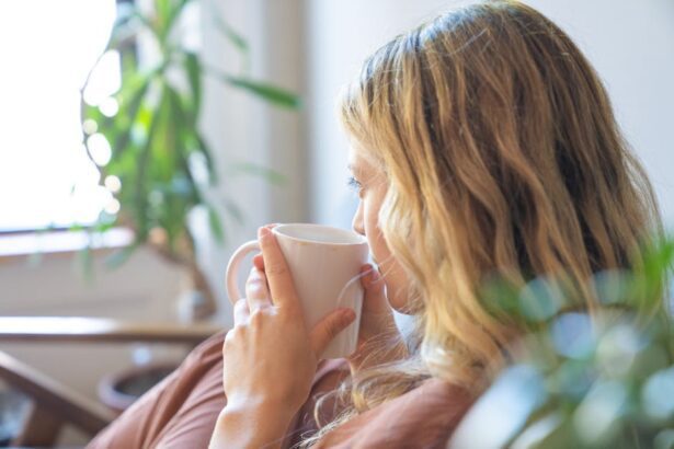 lento - A blonde woman enjoys coffee indoors, creating a cozy and calming atmosphere.